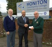 Lions Bill and Ed presenting 100 to Gary Wills from Honiton College