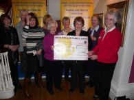 Mary Bolshaw receives the 500 for HOSPISCARE from Lions Ladies