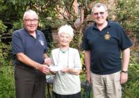 Lions Bill and Barnard presenting the cheque for 250 to Vision OM