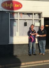 Chippie Joe receives the 250 red duck winnings 