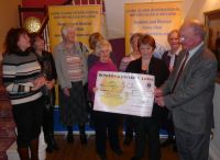 Jean & David Cantlefrom FORCE receive their 500 cheque surrounded by the Lions Ladies