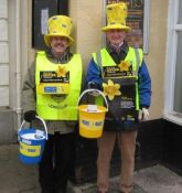 Lions John and Ed with big yellow hats collecting for Marie Curie