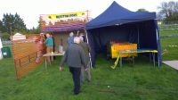 Setting up stalls for crockery smashing and sweets