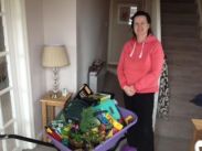 Winner of the wheelbarrow raffle Mrs Witt with the GOODS