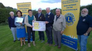 Morgan Davy with her mother and the £250 from Lions