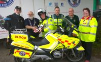 Lions 2100 DeFib being installed on First responder bike